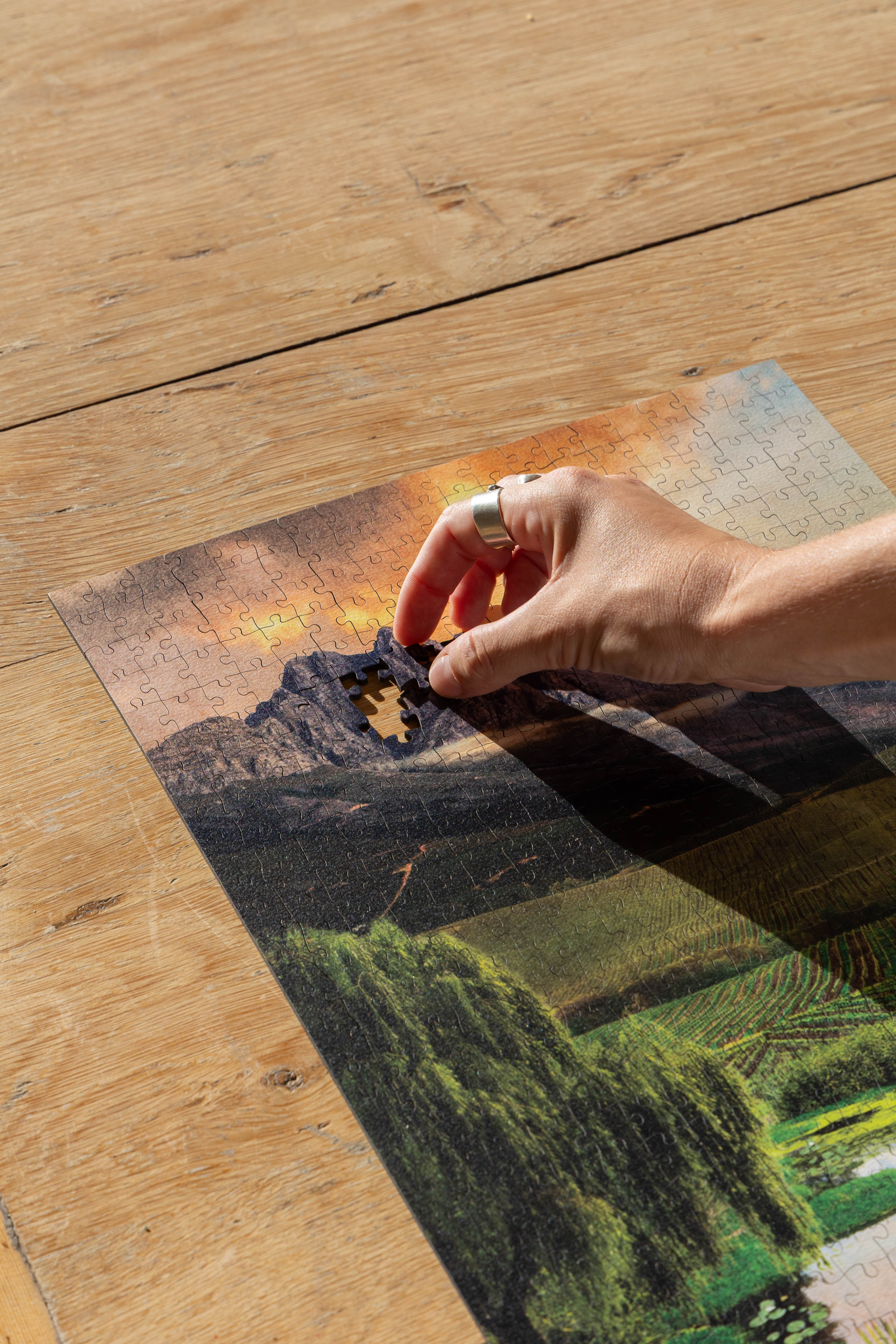 Stellenbosch is a MasterPiece wooden jigsaw puzzle from the African Odyssey poster series designed to showcase Africa’s most iconic natural wonders. This design captures one of the country's oldest towns renowned wine region. Precision-cut from 3mm thick wood and expertly printed, our MasterPiece puzzles offer a tactile and satisfying puzzling experience like no other. They are perfect for art lovers, nature enthusiasts and anyone looking for a thoughtful gift.