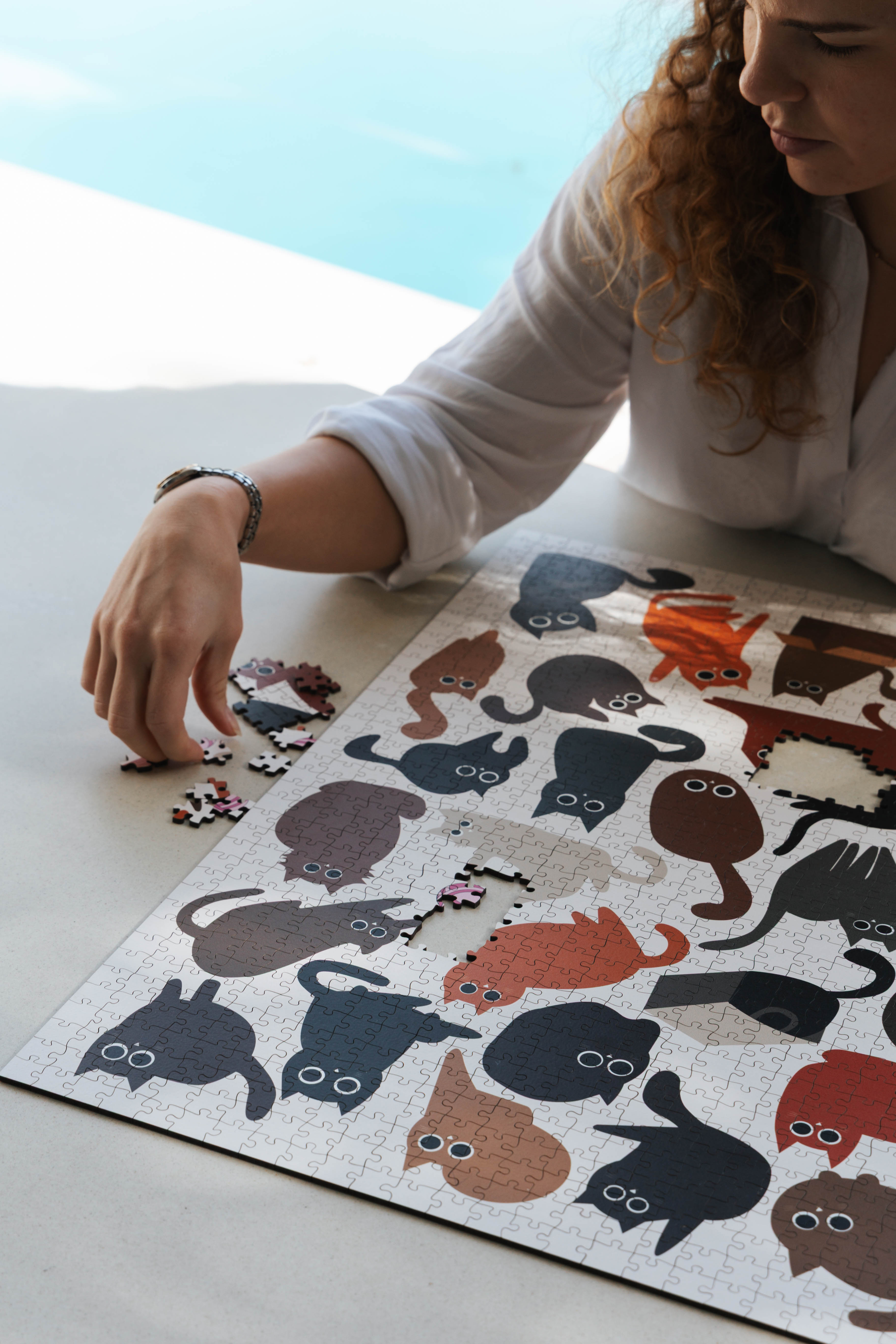 Curious Cats is a MasterPiece wooden jigsaw puzzle featuring a delightful collection of curious cats in various poses and playful scenes. This charming puzzle is a must-have for cat lovers! Precision-cut from 3mm thick wood and expertly printed, our MasterPiece puzzles offer a tactile and satisfying puzzling experience like no other. like no other. This puzzle is perfect for 'crazy cat ladies', art lovers and anyone looking for a thoughtful gift.