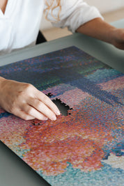 The Pink Cloud is a MasterPiece wooden jigsaw puzzle of a serene landscape featuring a soft, glowing sky. This artwork captures Henri-Edmond Cross’s expressive use of colour and atmosphere.

Precision-cut from 3mm thick wood and expertly printed, our MasterPiece puzzles offer a tactile and satisfying puzzling experience like no other. They are perfect for classic art lovers and anyone looking for a thoughtful gift. 
