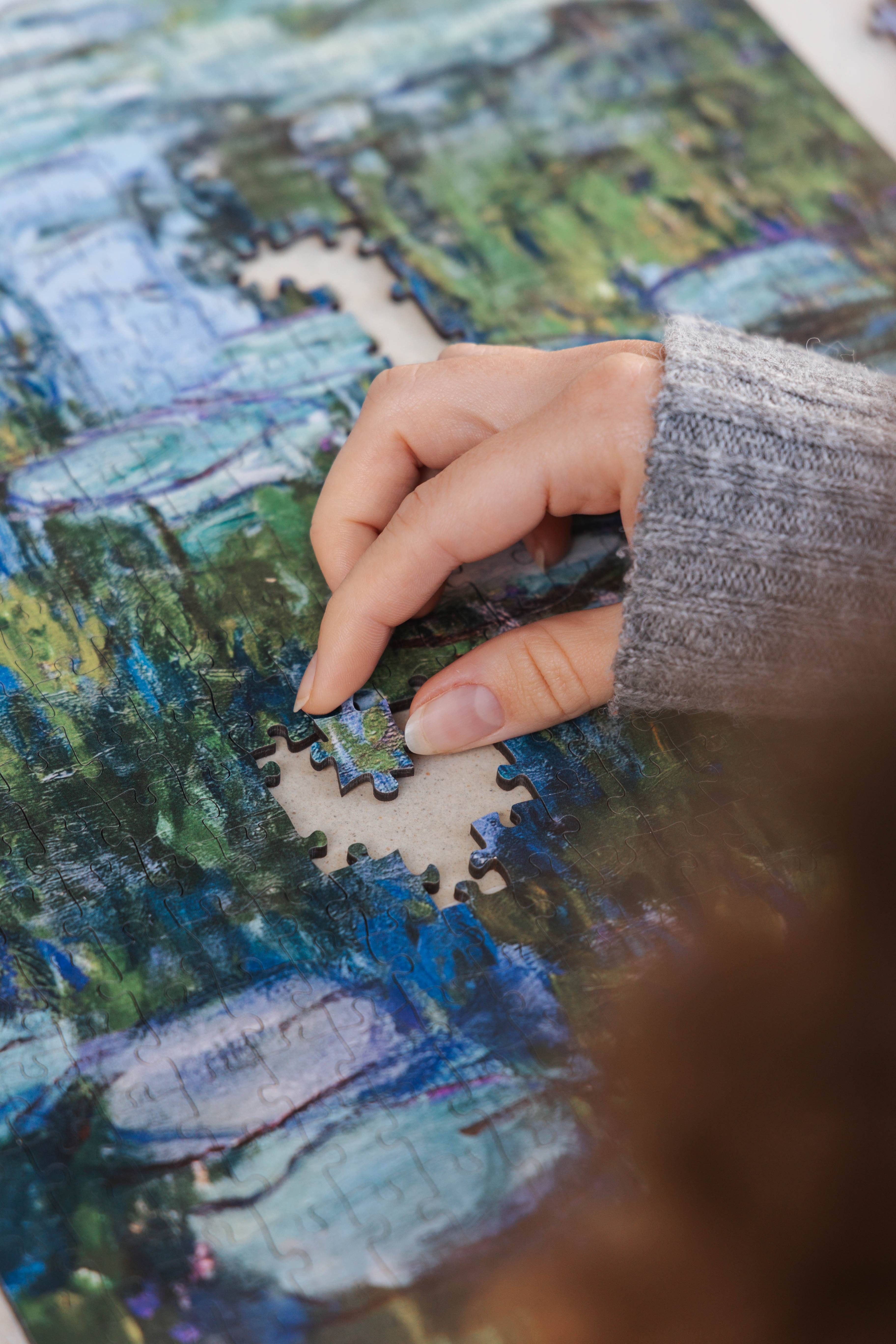 Water Lilies and Japanese Bridge is a&nbsp;MasterPiece wooden jigsaw puzzle&nbsp;of one of Claude Monet’s iconic paintings. This is an Impressionist masterpiece portraying his garden in Giverny. The painting features a serene pond covered in floating water lilies, with a softly arched Japanese bridge overhead.&nbsp;

Precision-cut from 3mm wood and expertly printed, our MasterPiece puzzles offer a tactile and satisfying puzzling experience like no other. They are perfect for&nbsp;classic&nbsp;art lovers&nbs