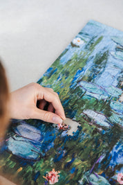 Water Lilies and Japanese Bridge is a&nbsp;MasterPiece wooden jigsaw puzzle&nbsp;of one of Claude Monet’s iconic paintings. This is an Impressionist masterpiece portraying his garden in Giverny. The painting features a serene pond covered in floating water lilies, with a softly arched Japanese bridge overhead.&nbsp;

Precision-cut from 3mm wood and expertly printed, our MasterPiece puzzles offer a tactile and satisfying puzzling experience like no other. They are perfect for&nbsp;classic&nbsp;art lovers&nbs