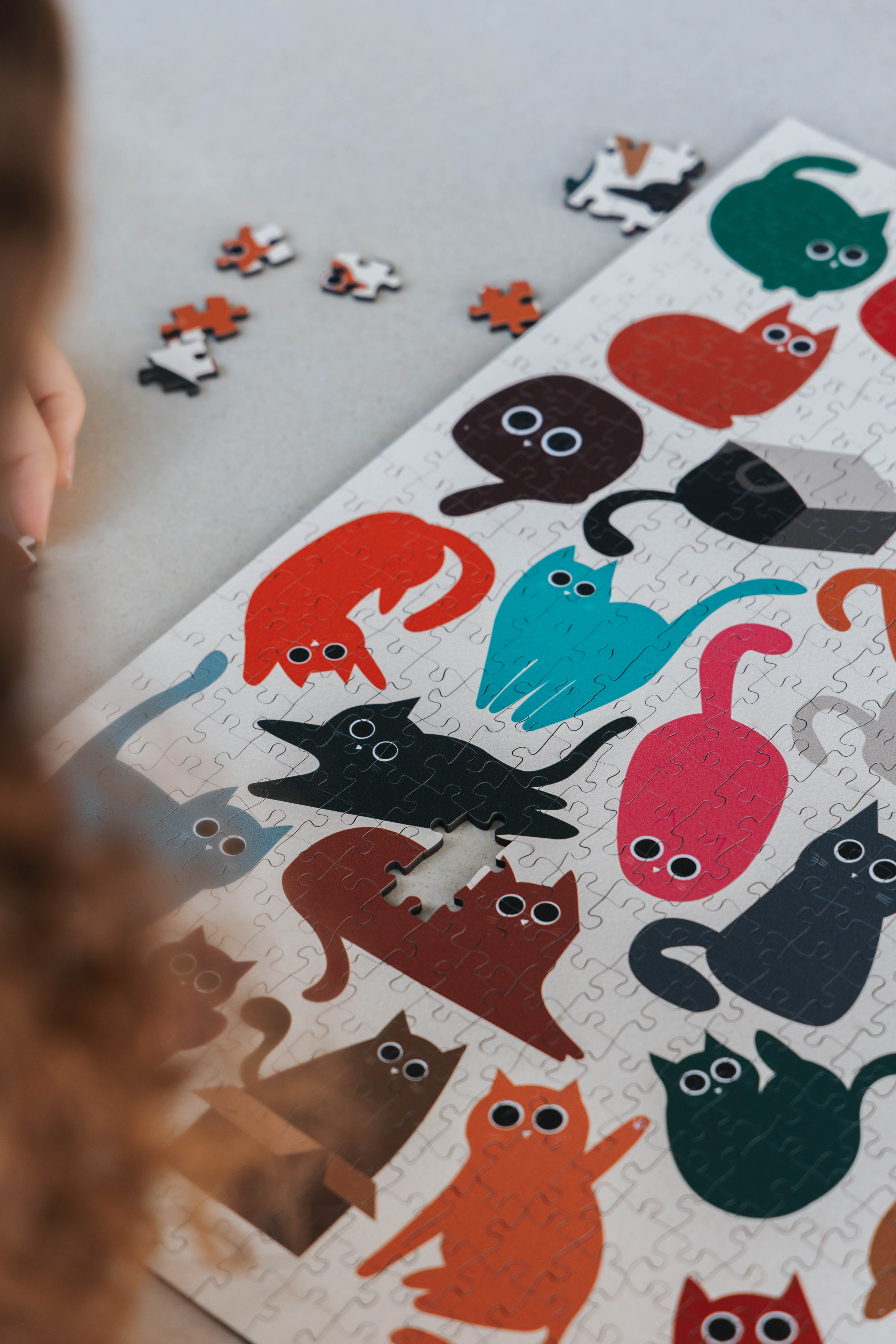 Curious Cats is a MasterPiece wooden jigsaw puzzle featuring a delightful collection of curious cats in various poses and playful scenes. This charming puzzle is a must-have for cat lovers! Precision-cut from 3mm thick wood and expertly printed, our MasterPiece puzzles offer a tactile and satisfying puzzling experience like no other. like no other. This puzzle is perfect for 'crazy cat ladies', art lovers and anyone looking for a thoughtful gift.