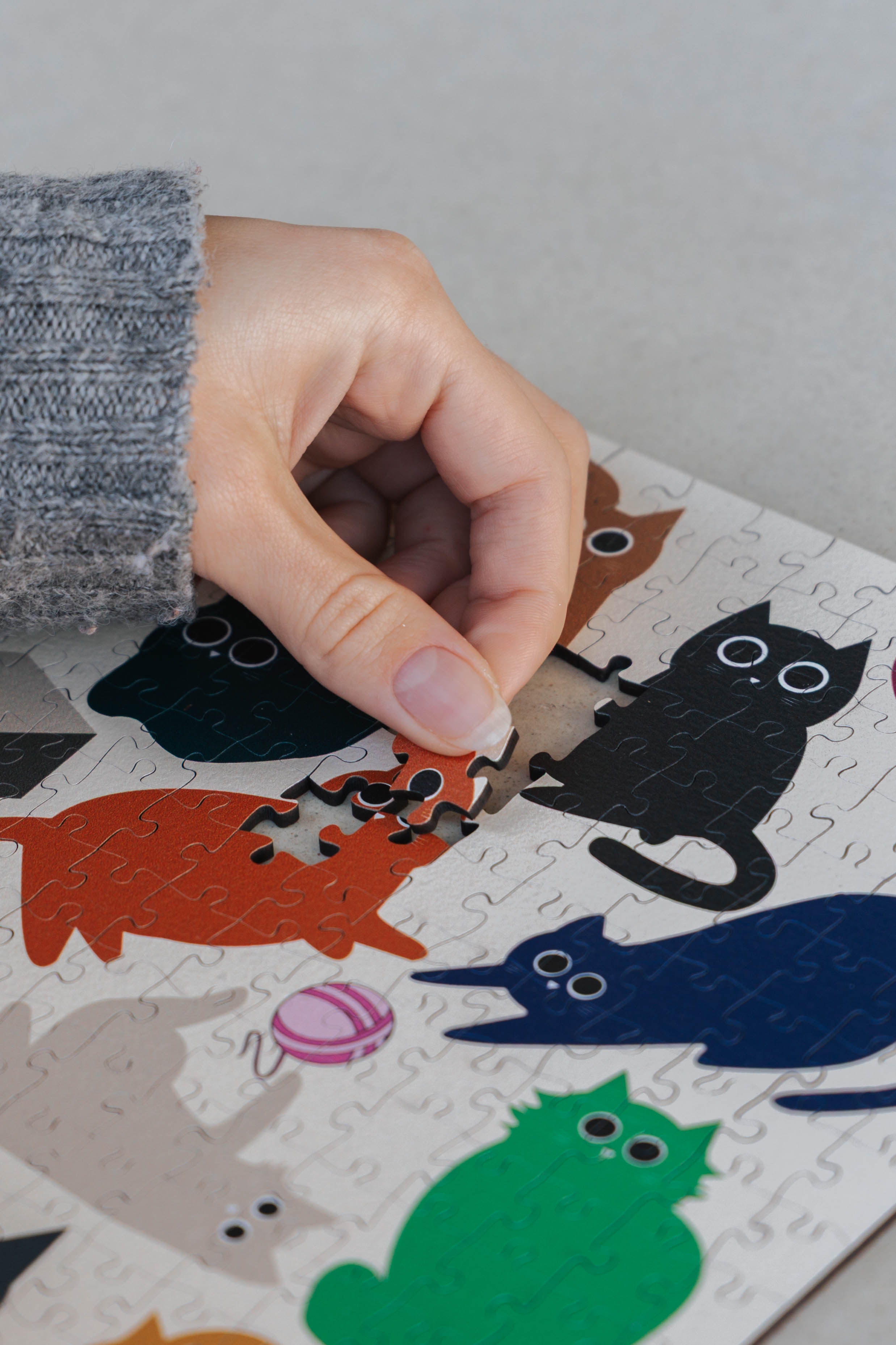 Curious Cats is a MasterPiece wooden jigsaw puzzle featuring a delightful collection of curious cats in various poses and playful scenes. This charming puzzle is a must-have for cat lovers! Precision-cut from 3mm thick wood and expertly printed, our MasterPiece puzzles offer a tactile and satisfying puzzling experience like no other. like no other. This puzzle is perfect for 'crazy cat ladies', art lovers and anyone looking for a thoughtful gift.