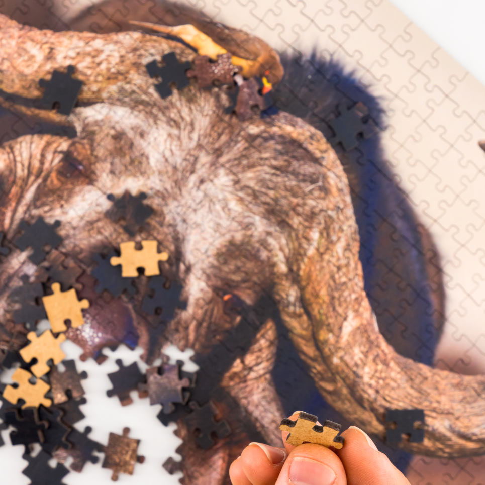 MasterPiece luxury wooden puzzle of a South African wildlife photograph of a buffalo and ox-pecker taken by Isak Pretorius. A way to disconnect, relieve stress and a great gift idea.