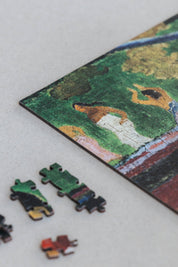 Arearea is a MasterPiece wooden jigsaw puzzle of one of Paul Gauguin's paintings. This is a vibrant Post-Impressionist painting depicting a lush Tahitian landscape. Precision-cut from 3mm thick wood and expertly printed, our MasterPiece puzzles offer a tactile and satisfying puzzling experience like no other. They are perfect for classic art lovers and anyone looking for a thoughtful gift. 