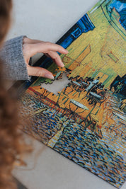 Café Terrace at Night is a MasterPiece wooden jigsaw puzzle of Vincent Van Gogh's painting featuring a warm glow of a café under a starry sky. Precision-cut from 3mm thick wood and expertly printed, our MasterPiece puzzles offer a tactile and satisfying puzzling experience like no other. They are perfect for classic art lovers and anyone looking for a thoughtful gift. 