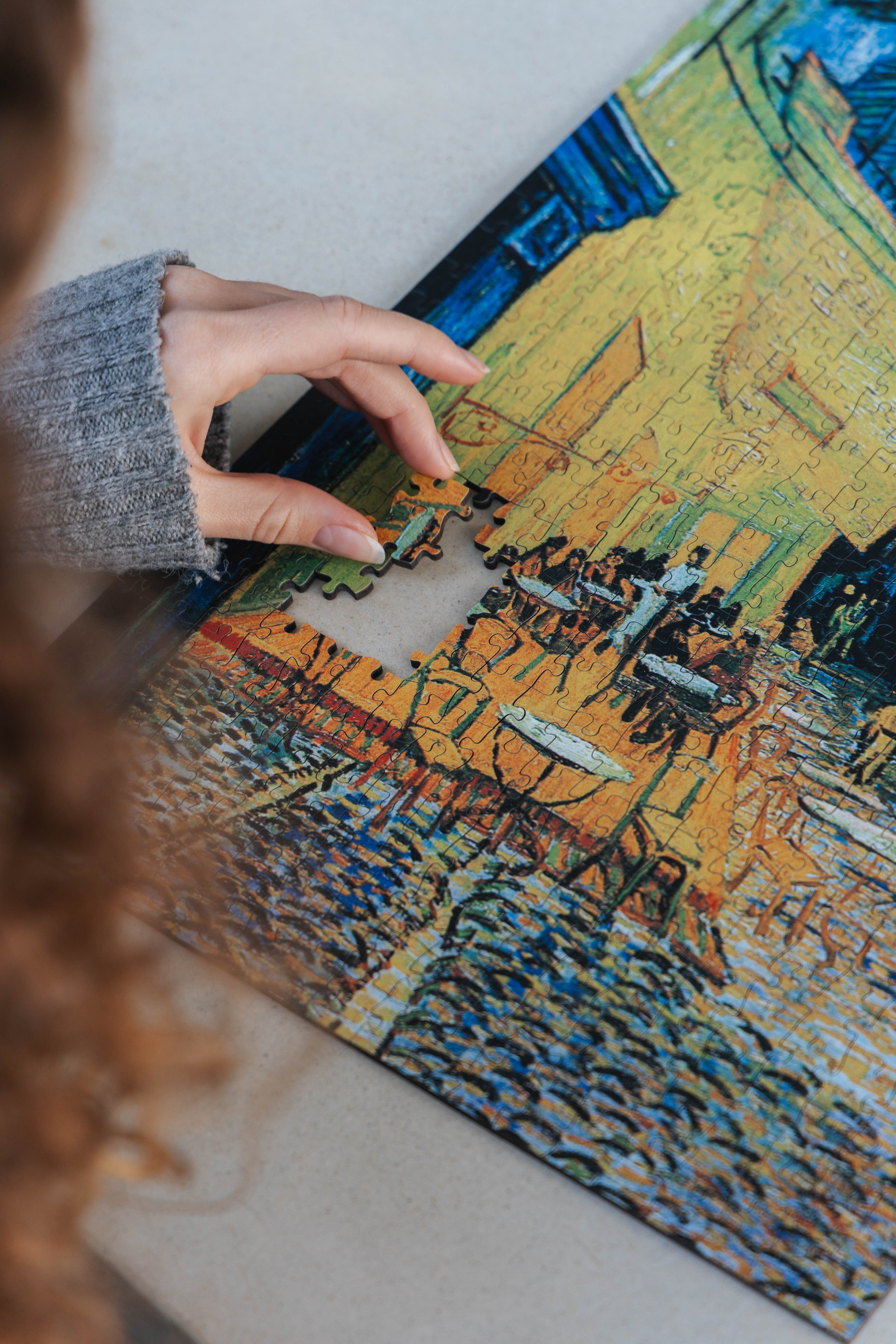 Café Terrace at Night is a MasterPiece wooden jigsaw puzzle of Vincent Van Gogh's painting featuring a warm glow of a café under a starry sky. Precision-cut from 3mm thick wood and expertly printed, our MasterPiece puzzles offer a tactile and satisfying puzzling experience like no other. They are perfect for classic art lovers and anyone looking for a thoughtful gift. 