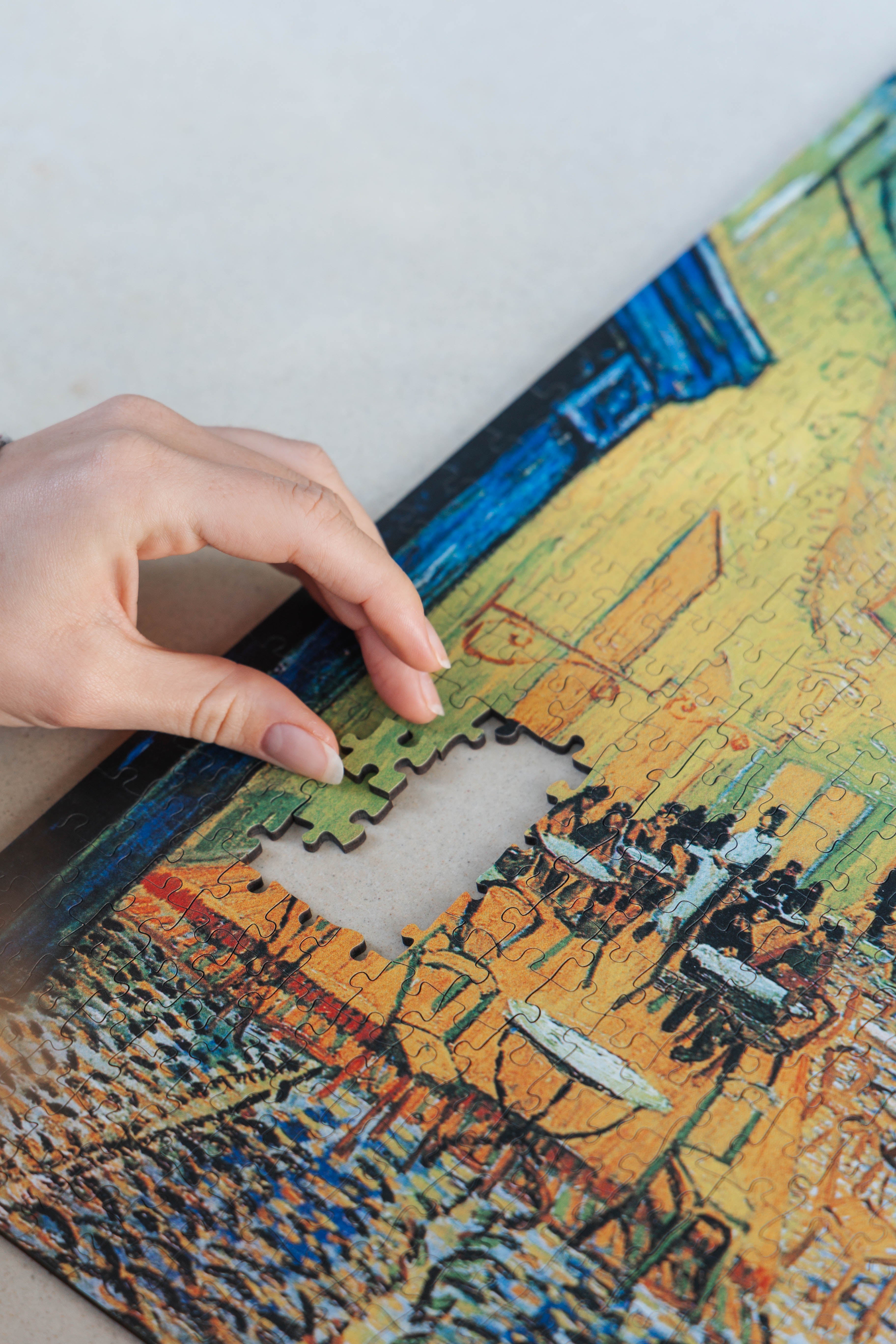 Café Terrace at Night is a MasterPiece wooden jigsaw puzzle of Vincent Van Gogh's painting featuring a warm glow of a café under a starry sky. Precision-cut from 3mm thick wood and expertly printed, our MasterPiece puzzles offer a tactile and satisfying puzzling experience like no other. They are perfect for classic art lovers and anyone looking for a thoughtful gift. 
