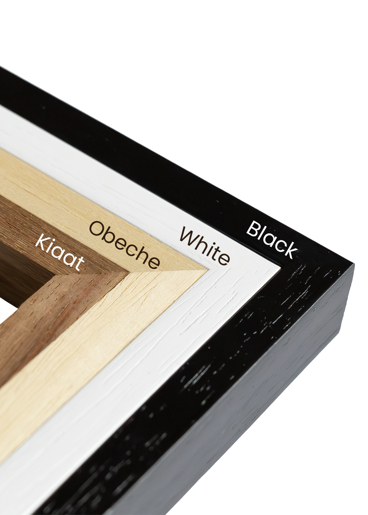 Four solid wood puzzle frame options displayed side by side in Black, White, Obeche, and Kiaat finishes, designed for A3 and A2 Masterpiece Puzzles with real glass fronts.