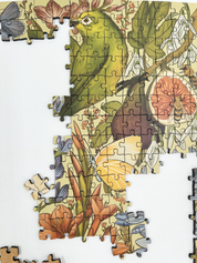 Fynbos Symphony is a MasterPiece wooden jigsaw puzzle that features a stunning nature-inspired illustration that is rich with diverse flora and fauna. Soft, earthy tones create a vintage botanical aesthetic, while vibrant birds and delicate insects bring the scene to life. Precision-cut from 3mm thick wood and expertly printed, our MasterPiece puzzles offer a tactile and satisfying puzzling experience like no other. They are perfect for art lovers, bird lovers and anyone looking for a thoughtful gift.