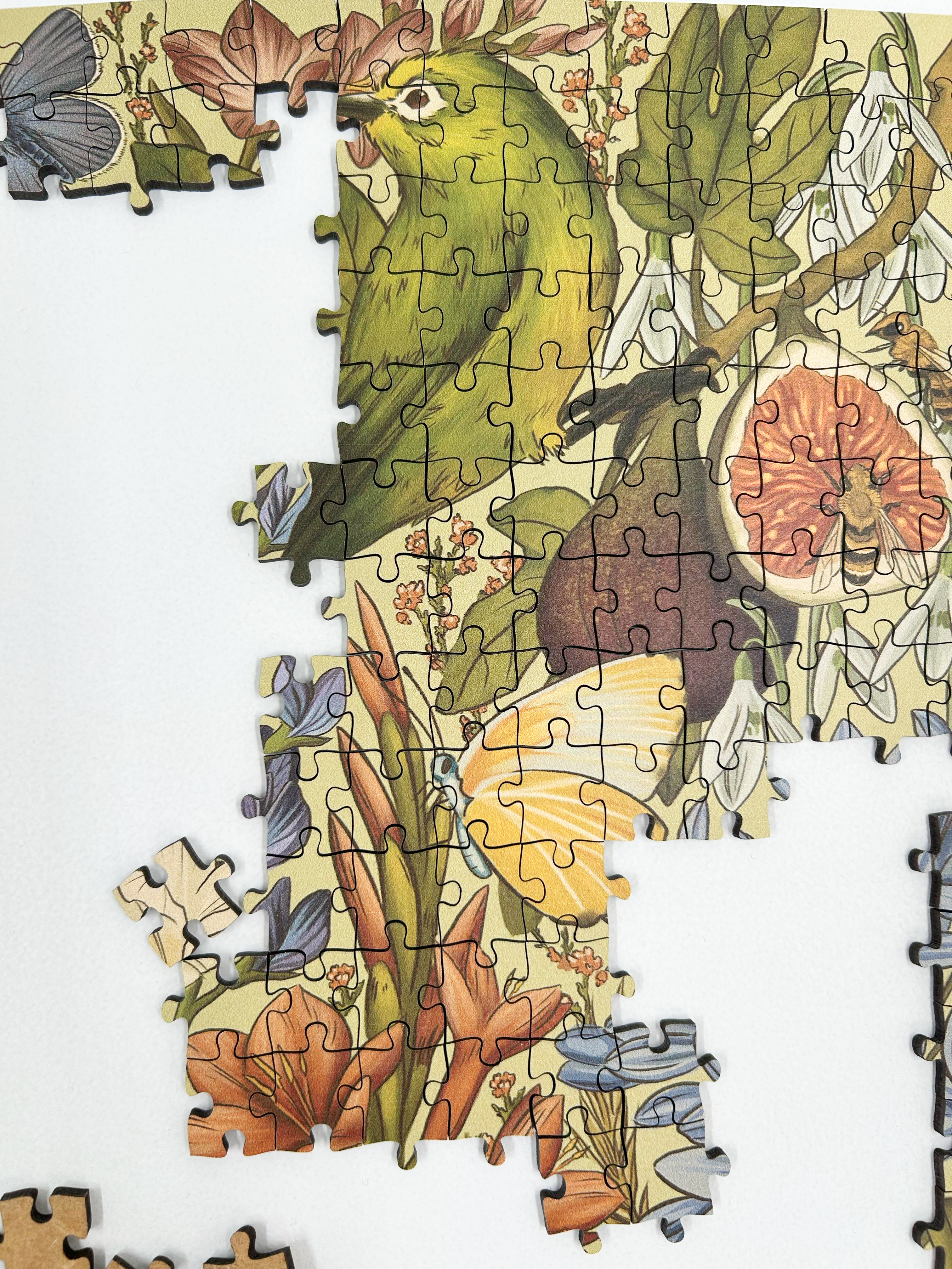 Fynbos Symphony is a MasterPiece wooden jigsaw puzzle that features a stunning nature-inspired illustration that is rich with diverse flora and fauna. Soft, earthy tones create a vintage botanical aesthetic, while vibrant birds and delicate insects bring the scene to life. Precision-cut from 3mm thick wood and expertly printed, our MasterPiece puzzles offer a tactile and satisfying puzzling experience like no other. They are perfect for art lovers, bird lovers and anyone looking for a thoughtful gift.