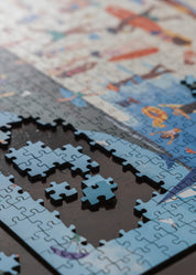 Close-up of a partially completed puzzle with a colorful background
