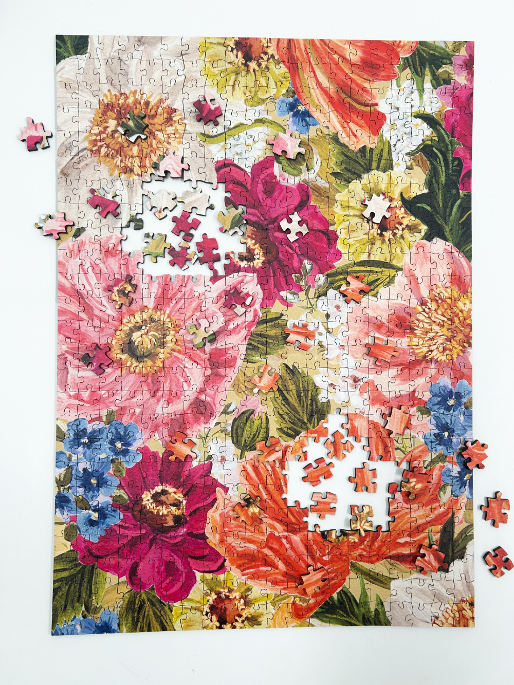 Floral puzzle with a partially completed design on a white background