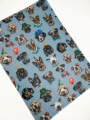 Wooden jigsaw puzzle with dog-themed pieces on a blue background