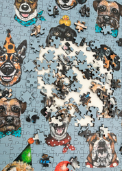 Wooden jigsaw puzzle with dog-themed pieces on a blue background
