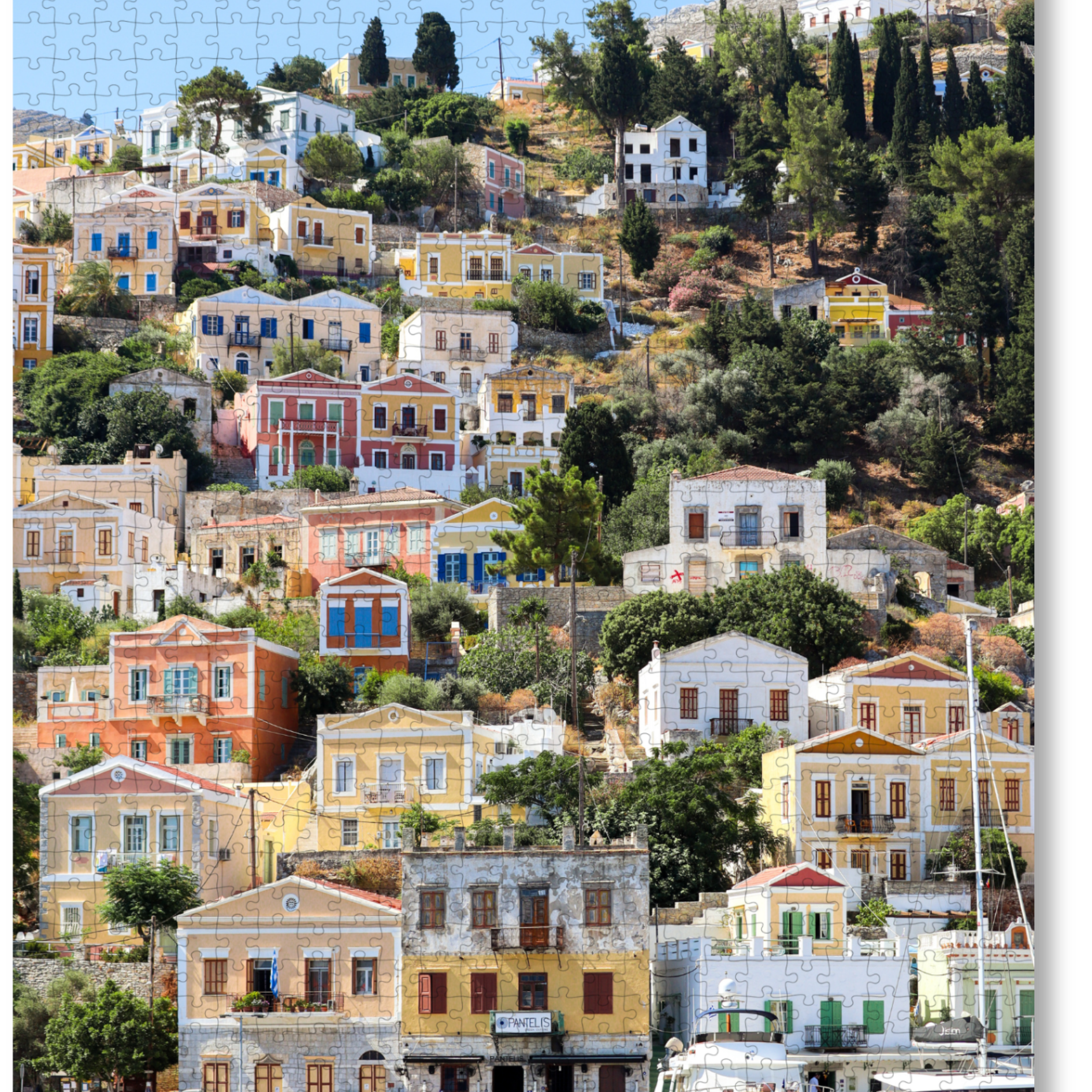 Island Charm is a MasterPiece wooden jigsaw puzzle that captures the early morning view on the ferry to Symi Island in Greece, where rows of the recognisable pastel-coloured houses rise from the harbour, each one with a better view than the next. Precision-cut from 3mm thick wood and expertly printed, our MasterPiece puzzles offer a tactile and satisfying puzzling experience like no other. They are perfect for travelers, Greece lovers and anyone looking for a thoughtful gift.   