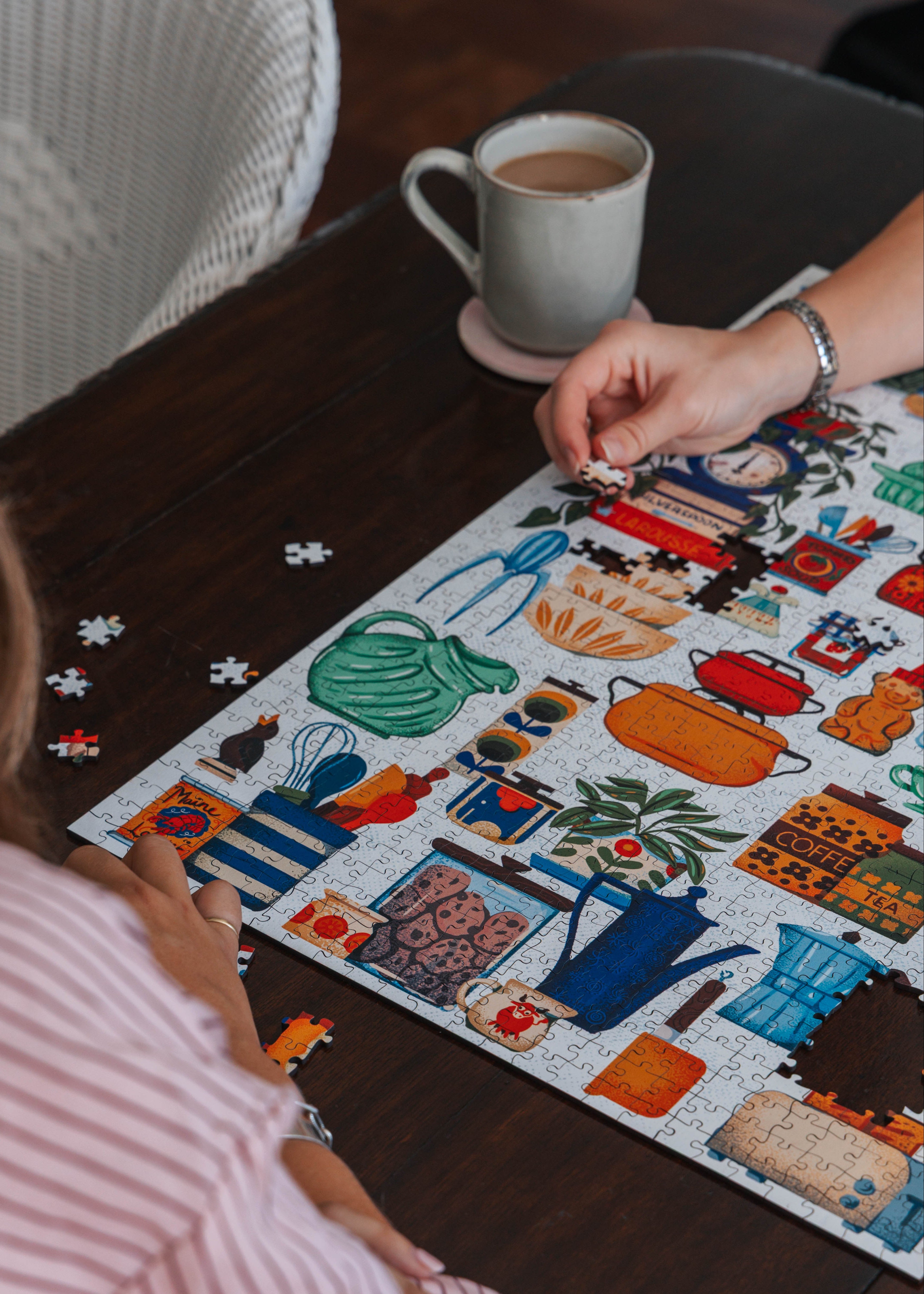 Kitchen Collection is a MasterPiece wooden jigsaw puzzle features a colourful array of vintage kitchenalia that we all remember. Building this puzzle feels like you're rummaging through a well-used cupboard in an eclectic kitchen of the past. Precision-cut from 3mm wood and expertly printed, our MasterPiece puzzles offer a tactile and satisfying puzzling experience like no other. This puzzle is perfect for art lovers, proud South Africans and anyone looking for a thoughtful gift.
