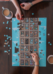 Two people working on a wooden puzzle on a wooden table with coffee cups.