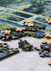 Jigsaw puzzle with completed pieces on a table