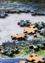 Jigsaw puzzle with completed pieces on a table