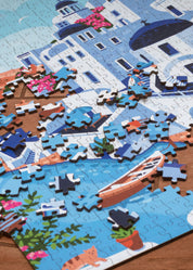 Jigsaw puzzle of a scenic layout with boats and buildings on a wooden surface