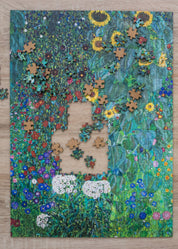 Jigsaw puzzle with a completed section of a colorful floral design on a wooden surface