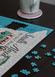 Jigsaw puzzle with completed pieces on a table, featuring animals and text.