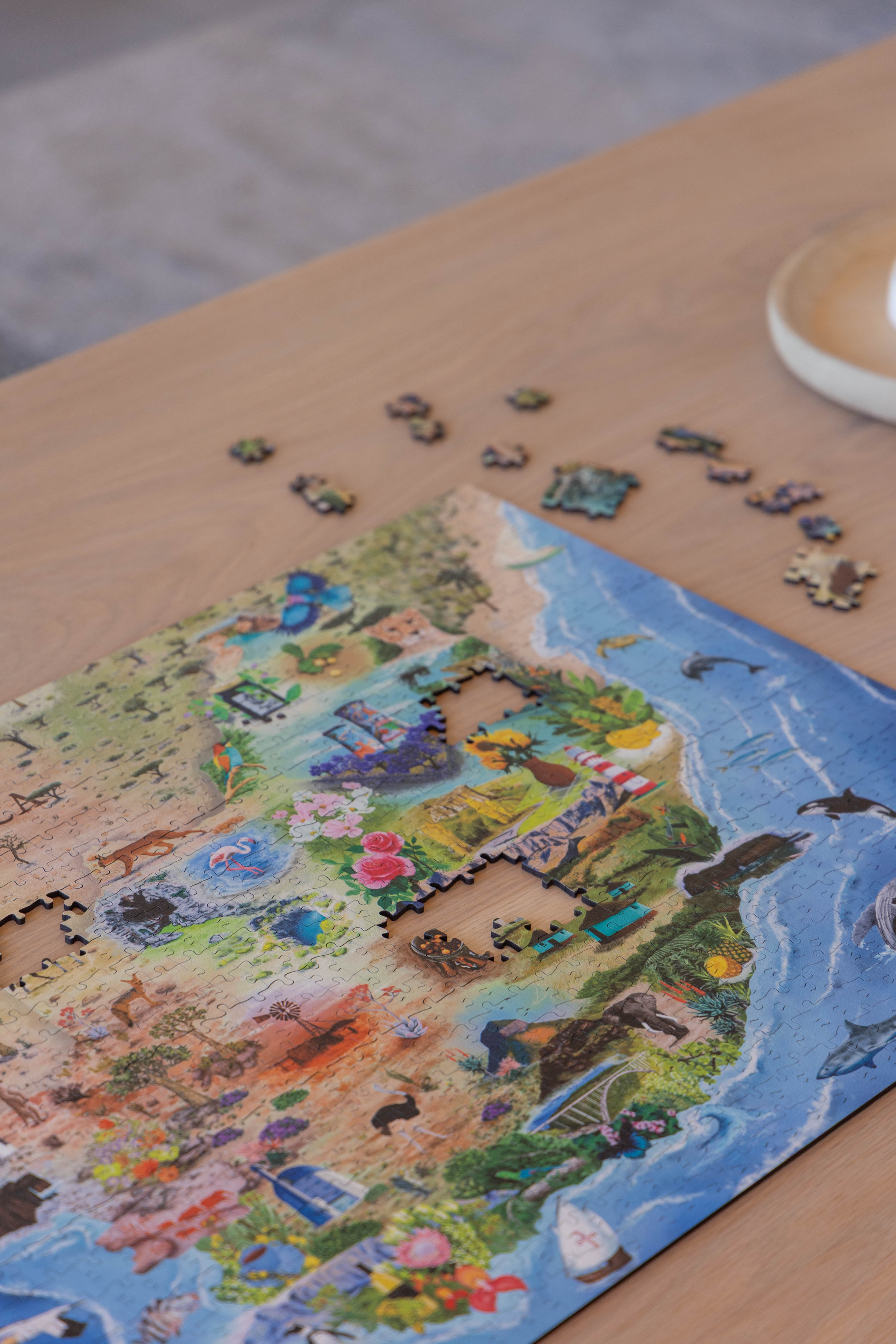 South Africa is a MasterPiece wooden jigsaw puzzle that brings together the landscapes, wildlife and iconic landmarks that make our country so special. From waves to wild bushveld to colourful flora and familiar scenes, each detail celebrates the richness of Mzansi. This is home.