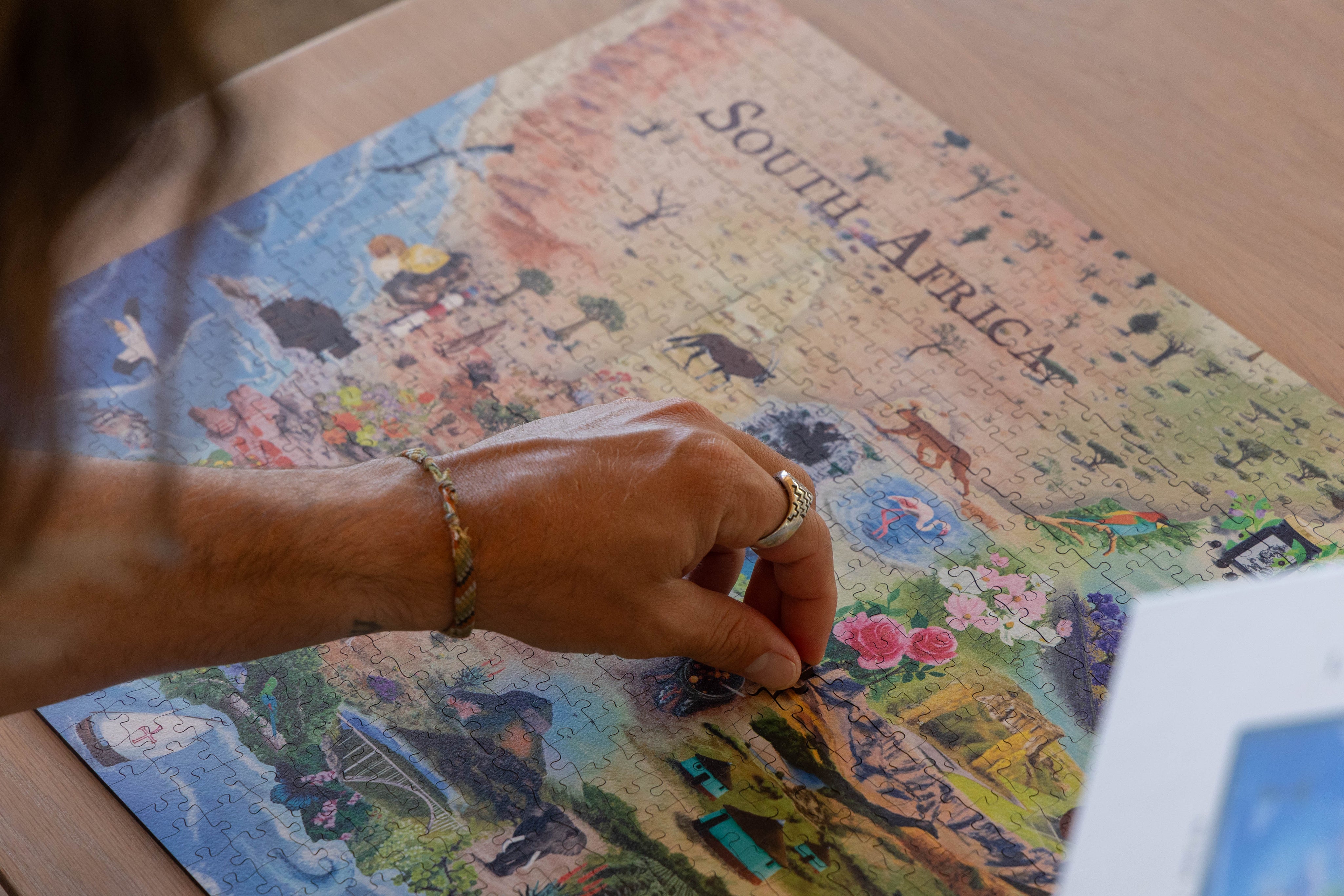 South Africa is a MasterPiece wooden jigsaw puzzle that brings together the landscapes, wildlife and iconic landmarks that make our country so special. From waves to wild bushveld to colourful flora and familiar scenes, each detail celebrates the richness of Mzansi. This is home.