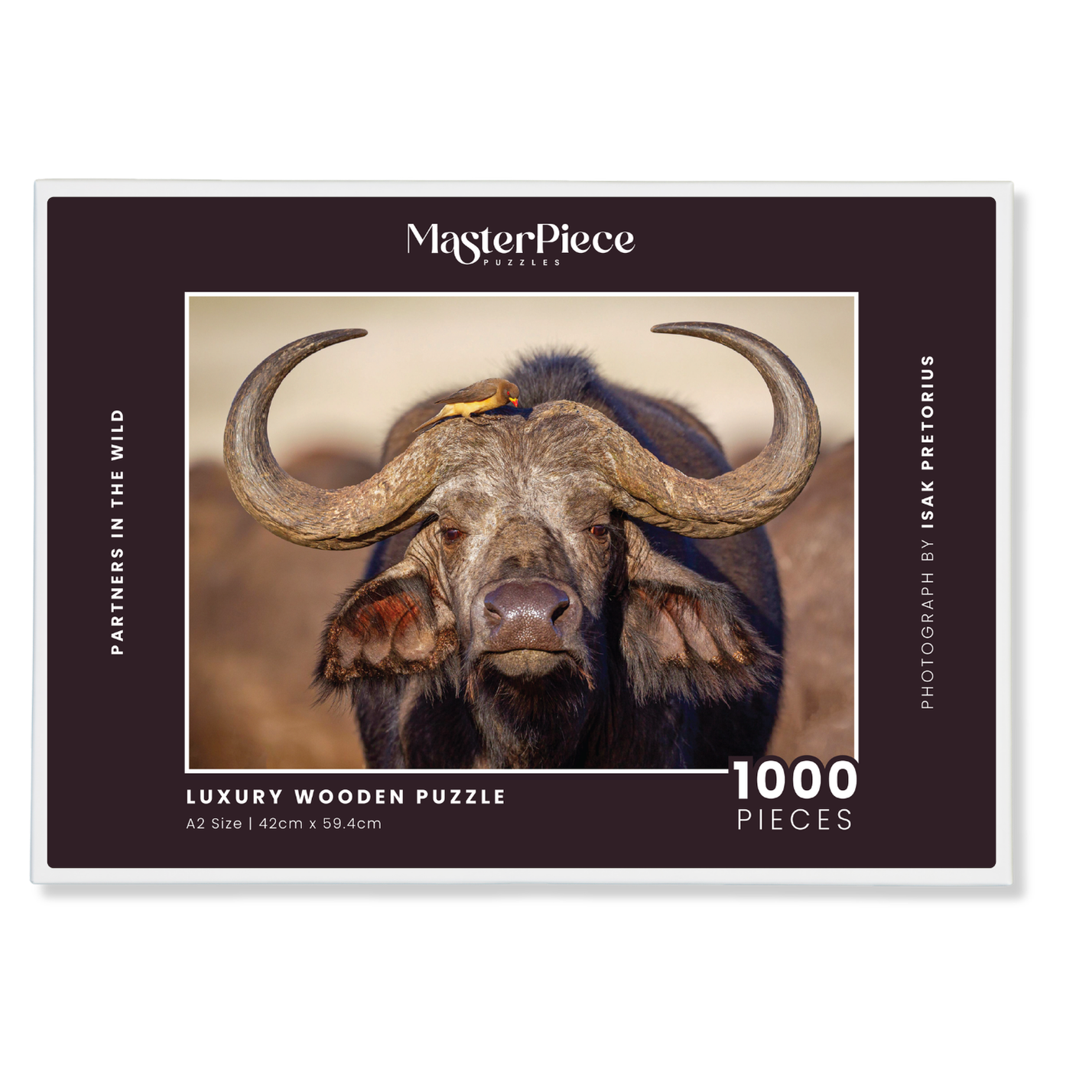 Partners in the Wild is a MasterPiece wooden jigsaw puzzle that features a beautiful portrait photograph of a buffalo and oxpecker. Precision-cut from 3mm thick wood and expertly printed, our MasterPiece puzzles offer a tactile and satisfying puzzling experience like no other. They are perfect for wildlife lovers, nature enthusiasts and anyone looking for a thoughtful gift. 