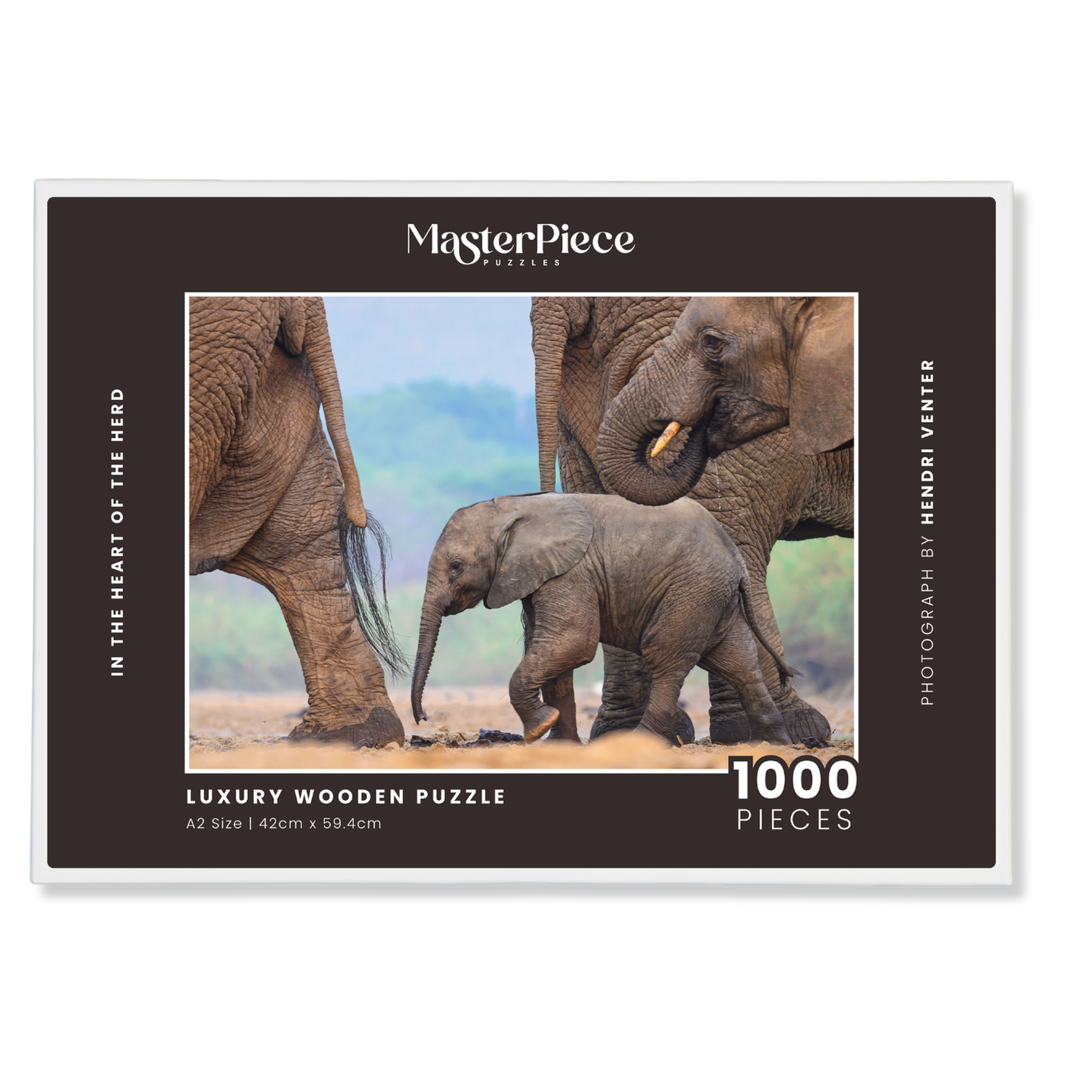 In The Heart Of The Herd is a MasterPiece wooden jigsaw puzzle that features a beautiful  photograph of an elephant calf walking among other elephants in its herd. Precision-cut from 3mm thick wood and expertly printed, our MasterPiece puzzles offer a tactile and satisfying puzzling experience like no other. They are perfect for wildlife lovers, nature enthusiasts and anyone looking for a thoughtful gift. 