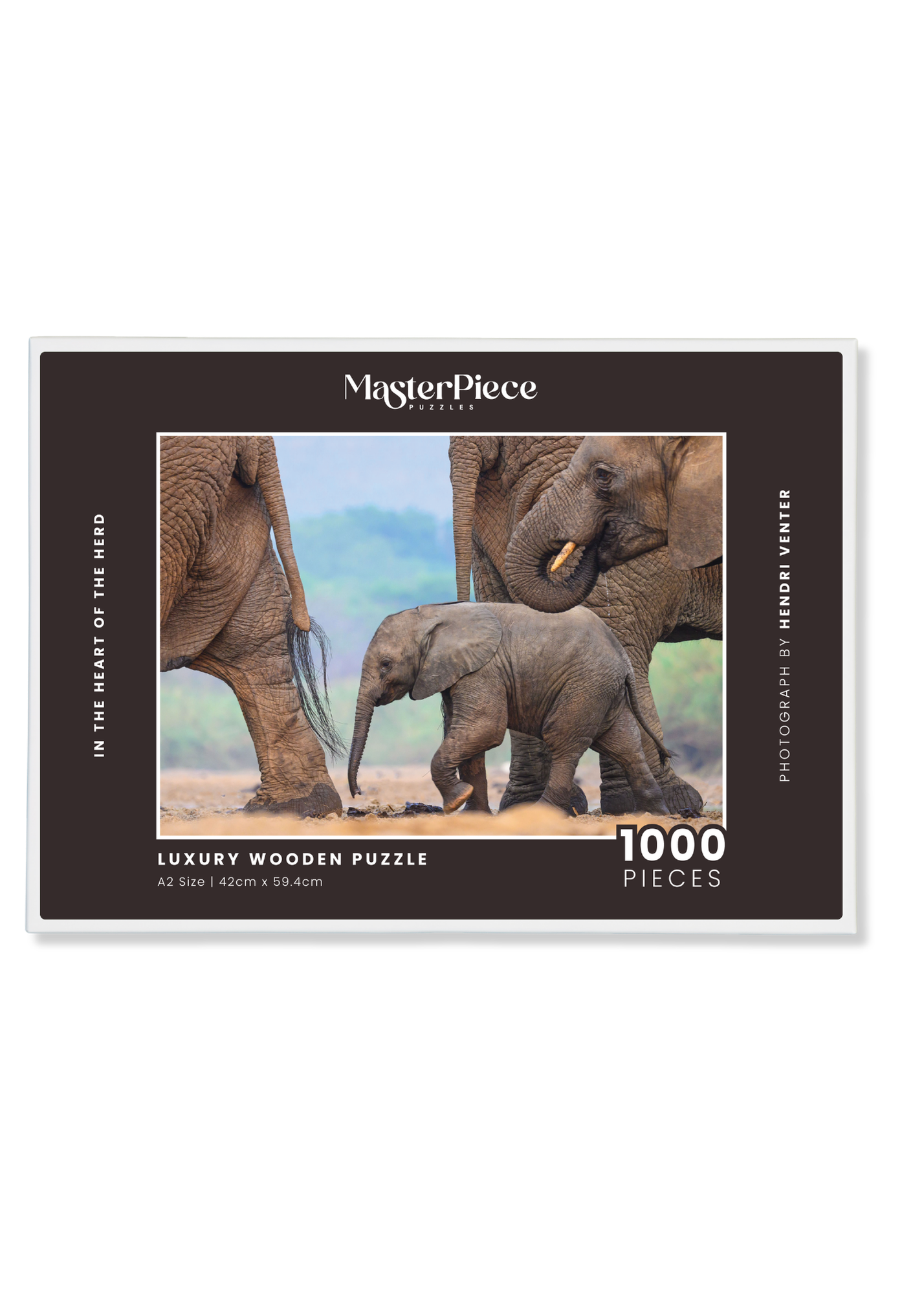 In The Heart Of The Herd is a MasterPiece wooden jigsaw puzzle that features a beautiful  photograph of an elephant calf walking among other elephants in its herd. Precision-cut from 3mm thick wood and expertly printed, our MasterPiece puzzles offer a tactile and satisfying puzzling experience like no other. They are perfect for wildlife lovers, nature enthusiasts and anyone looking for a thoughtful gift. 