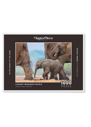 In The Heart Of The Herd is a MasterPiece wooden jigsaw puzzle that features a beautiful  photograph of an elephant calf walking among other elephants in its herd. Precision-cut from 3mm thick wood and expertly printed, our MasterPiece puzzles offer a tactile and satisfying puzzling experience like no other. They are perfect for wildlife lovers, nature enthusiasts and anyone looking for a thoughtful gift. 