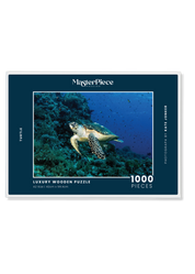 Turtle is a MasterPiece wooden jigsaw puzzle that features a beautiful underwater photograph of a turtle swimming in front of a coral reef.

Precision-cut from 3mm wood and expertly printed, our MasterPiece puzzles offer a tactile and satisfying puzzling experience like no other. They are perfect for ocean lovers, nature enthusiasts and anyone looking for a thoughtful gift.