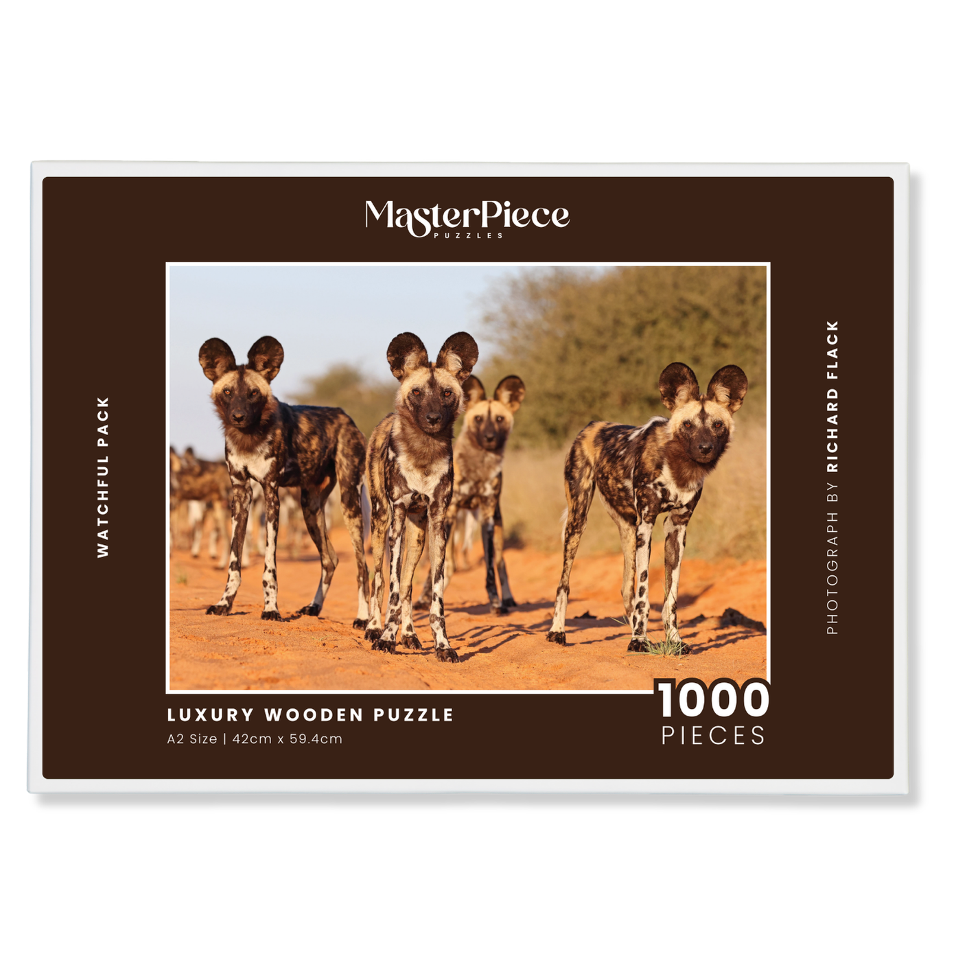 Watchful Pack is a MasterPiece wooden jigsaw puzzle featuring a striking photograph of a pack of wild dogs looking right at you.

Precision-cut from 3mm thick wood and expertly printed, our MasterPiece puzzles offer a tactile and satisfying puzzling experience like no other. They are perfect for wildlife lovers, nature enthusiasts and anyone looking for a thoughtful gift.