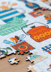 Puzzle with colorful illustrations of kitchen items and animals.