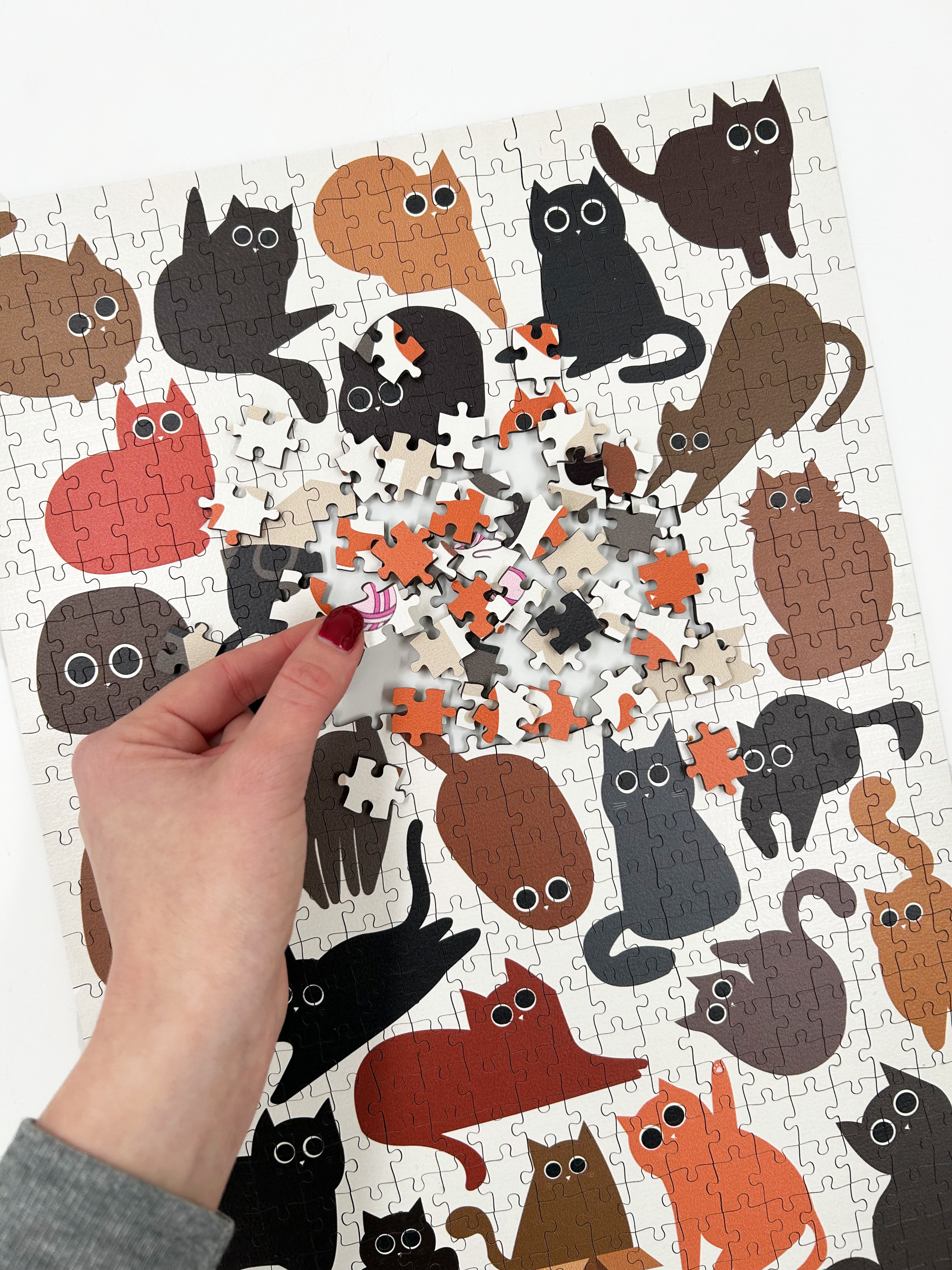 Curious Cats is a MasterPiece wooden jigsaw puzzle featuring a delightful collection of curious cats in various poses and playful scenes. This charming puzzle is a must-have for cat lovers! Precision-cut from 3mm thick wood and expertly printed, our MasterPiece puzzles offer a tactile and satisfying puzzling experience like no other. like no other. This puzzle is perfect for 'crazy cat ladies', art lovers and anyone looking for a thoughtful gift.