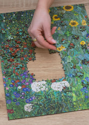 Farm Garden with Sunflowers is a MasterPiece wooden jigsaw puzzle of one of Gustav Klimt’s paintings. This richly detailed painting captures a blooming garden in full colour, showcasing Klimt’s signature style and love for organic beauty.

Precision-cut from 3mm thick wood and expertly printed, our MasterPiece puzzles offer a tactile and satisfying puzzling experience like no other. They are perfect for classic art lovers and anyone looking for a thoughtful gift. 