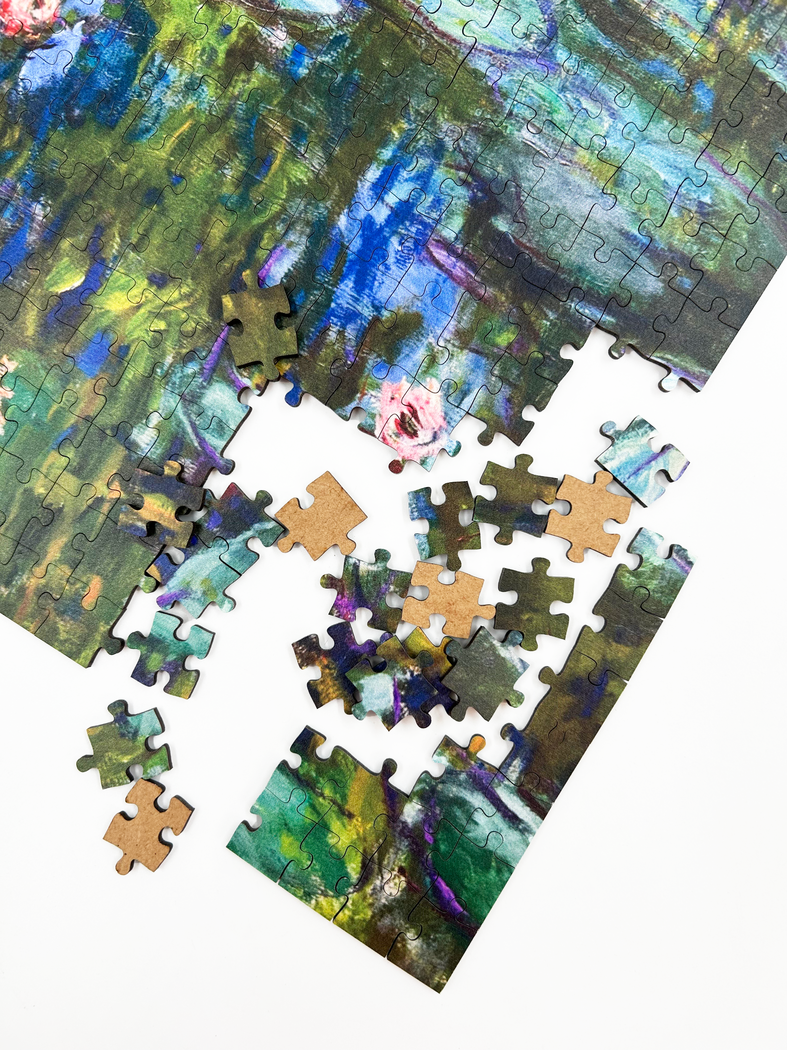 Water Lilies is a MasterPiece wooden jigsaw puzzle of one of Claude Monet’s iconic paintings. This Impressionist piece captures the tranquil beauty of his garden in Giverny. The artwork showcases a  pond filled with water lilies in soft, blended hues of blue, green and pink. 

Precision-cut from 3mm wood and expertly printed, our MasterPiece puzzles offer a tactile and satisfying puzzling experience like no other. They are perfect for classic art lovers and anyone looking for a thoughtful gift.