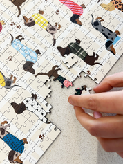 Stylish Sausages is a MasterPiece wooden jigsaw puzzle featuring an adorable line-up of sausage dogs strutting their stuff in various colourful jerseys and scarves, a must-have for dachshund lovers!

Precision-cut from 3mm thick wood and expertly printed, our MasterPiece puzzles offer a tactile and satisfying puzzling experience like no other. This puzzle is perfect for dachshund lovers and anyone looking for a thoughtful gift. 