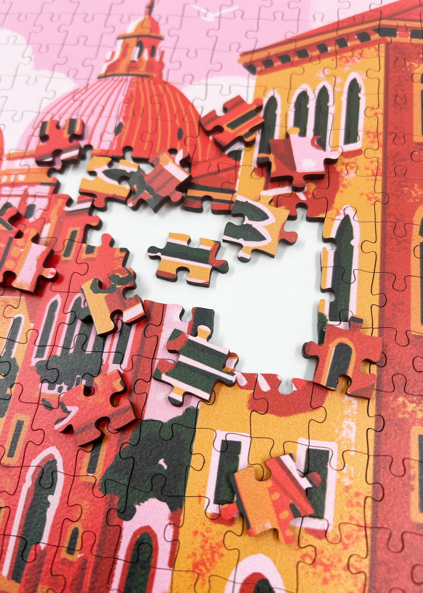 A MasterPiece luxury wooden puzzle of Venice, the floating city. This puzzle features a gondola, pastel buildings and a pink sky. Great for a keep-sake, heirloom, gift ideas and even wall art or home decor if framed.