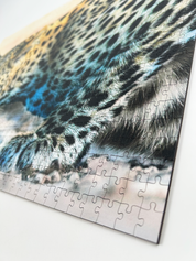 Whiskers And Water is a MasterPiece wooden jigsaw puzzle that features a beautiful photograph of a leopard drinking at the water's edge.

Precision-cut from 3mm wood and expertly printed, our MasterPiece puzzles offer a tactile and satisfying puzzling experience like no other. They are perfect for wildlife lovers, nature enthusiasts and anyone looking for a thoughtful gift.