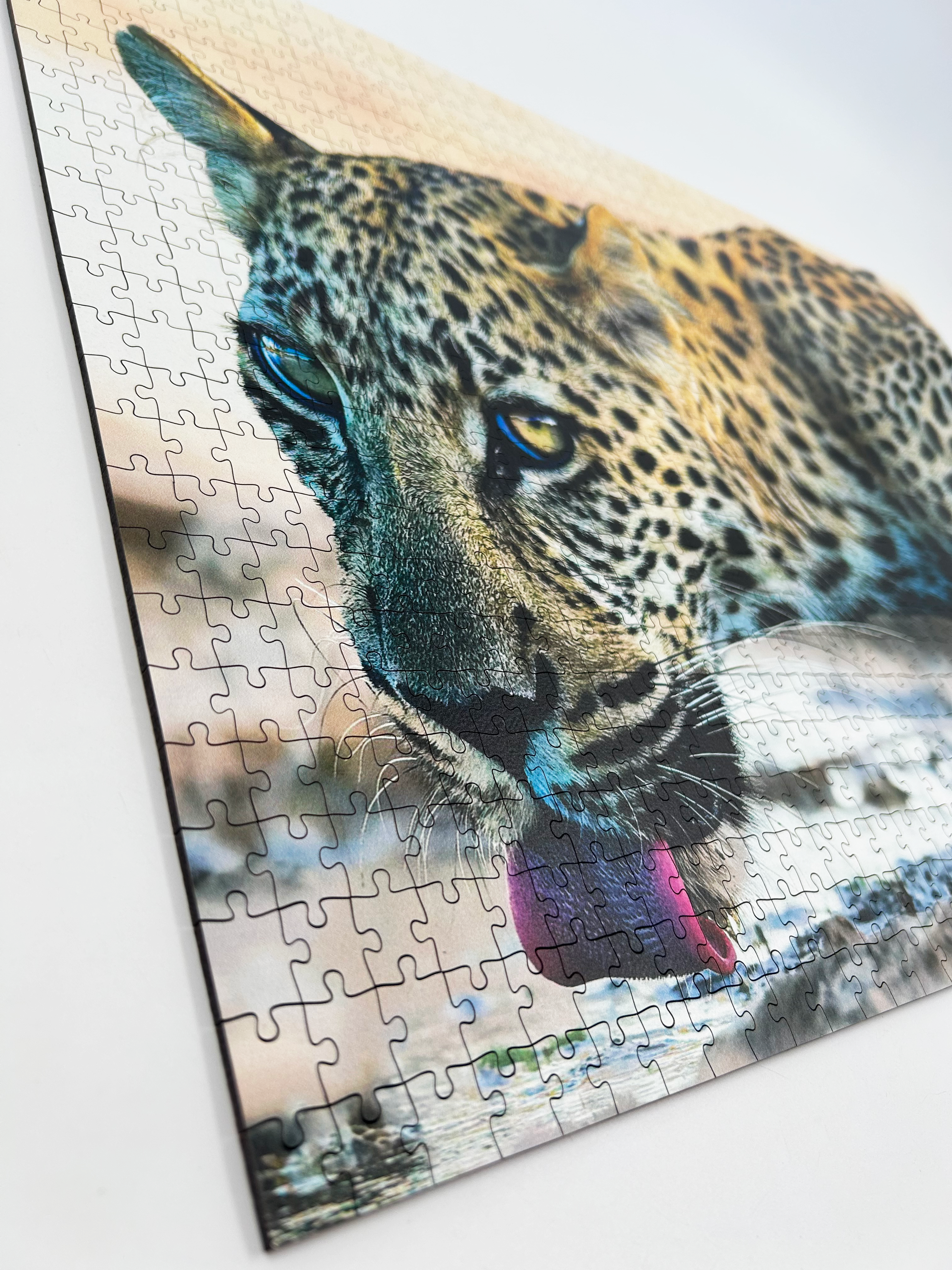 Whiskers And Water is a MasterPiece wooden jigsaw puzzle that features a beautiful photograph of a leopard drinking at the water's edge.

Precision-cut from 3mm wood and expertly printed, our MasterPiece puzzles offer a tactile and satisfying puzzling experience like no other. They are perfect for wildlife lovers, nature enthusiasts and anyone looking for a thoughtful gift.