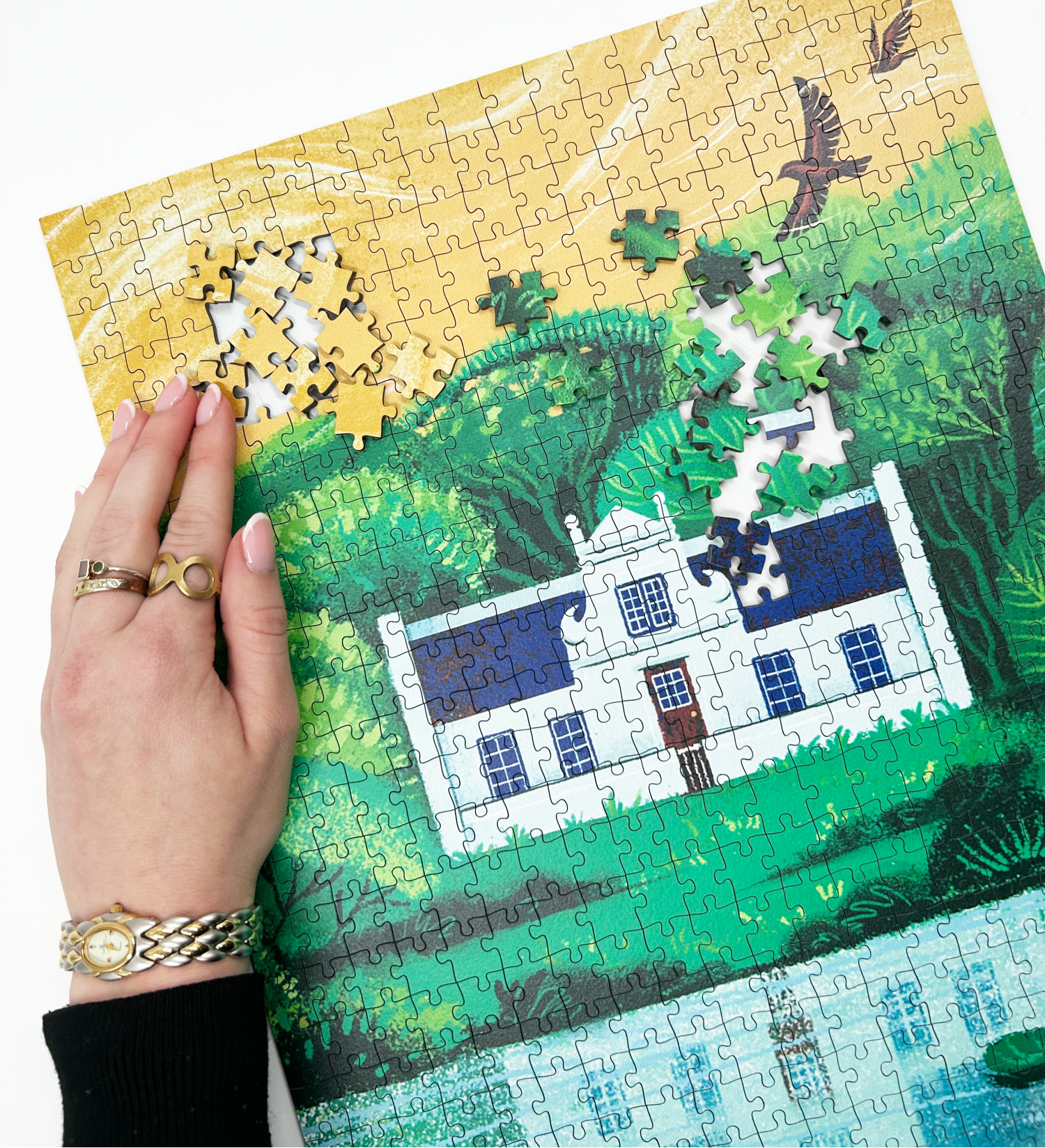 A wooden jigsaw puzzle featuring an illustration of the Zevenwacht Wine Estate manor house. Perfect for art lovers and anyone looking for a thoughtful gift. 
