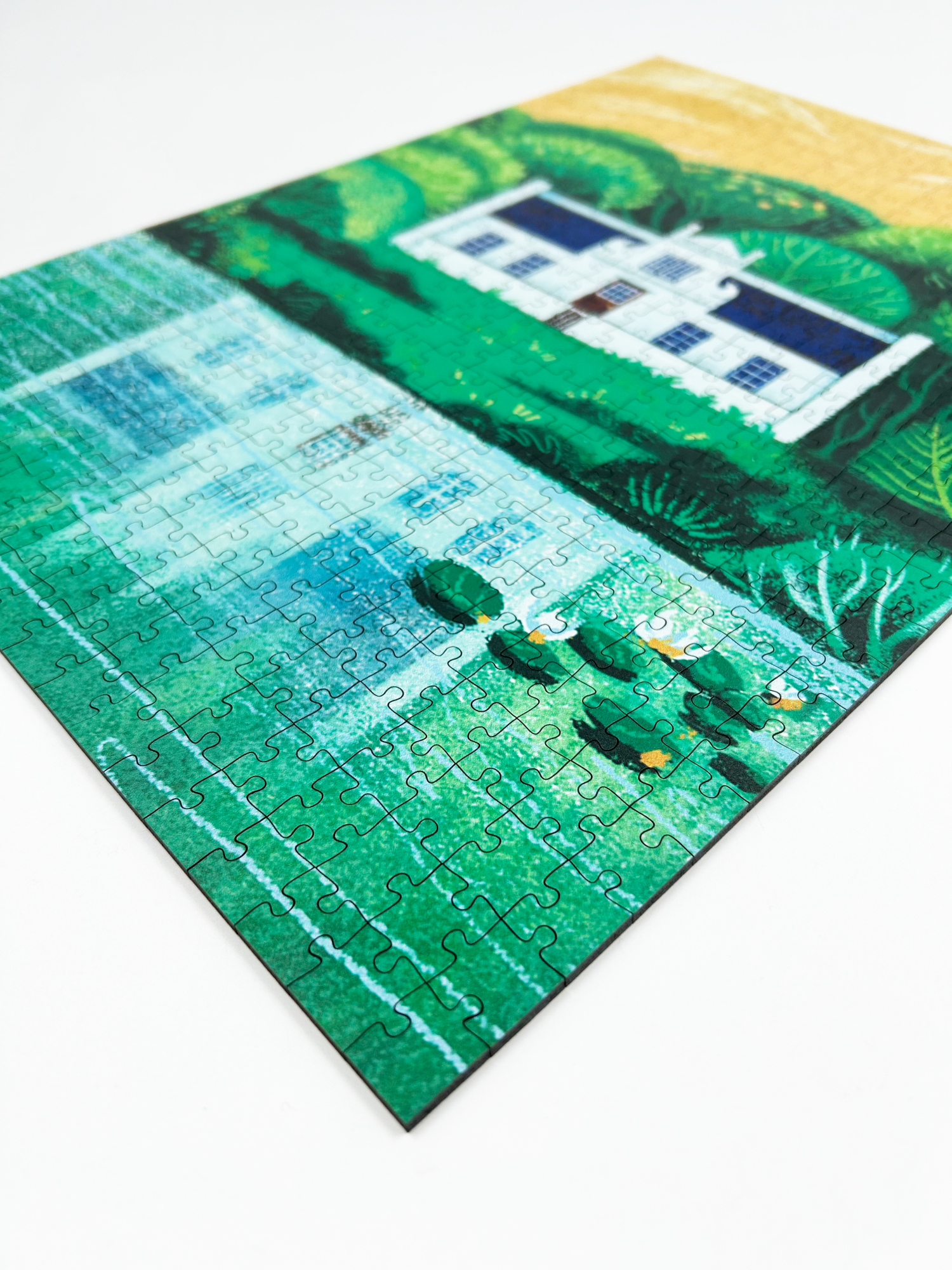 A wooden jigsaw puzzle featuring an illustration of the Zevenwacht Wine Estate manor house. Perfect for art lovers and anyone looking for a thoughtful gift. 