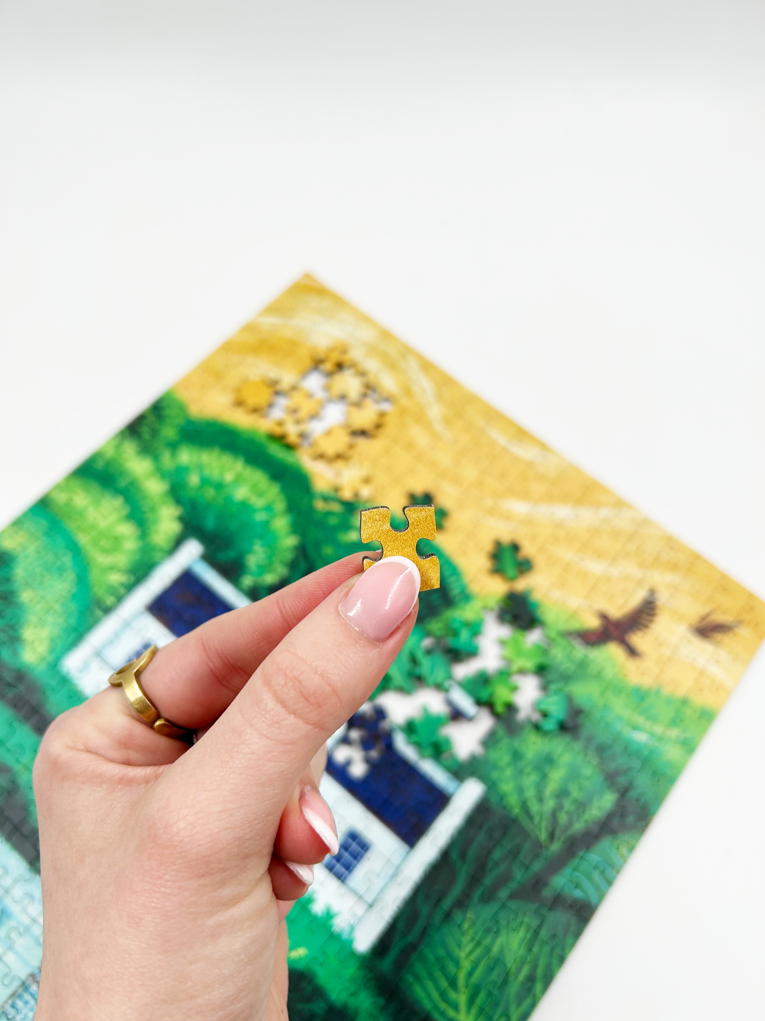 A wooden jigsaw puzzle featuring an illustration of the Zevenwacht Wine Estate manor house. Perfect for art lovers and anyone looking for a thoughtful gift. 