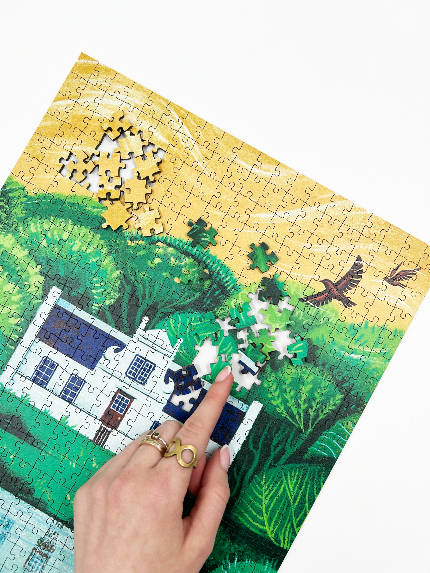 A wooden jigsaw puzzle featuring an illustration of the Zevenwacht Wine Estate manor house. Perfect for art lovers and anyone looking for a thoughtful gift. 